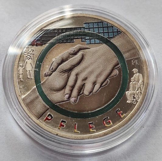 10 EURO MÜNZE - PFLEGE DIENST 2022 - POLYMERRING - KOLORIERT